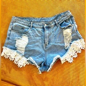 Jean shorts with lace trim and shredded front fashion